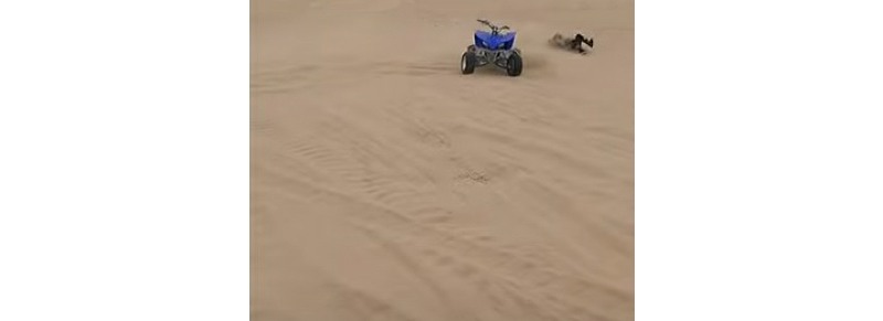 Youtube video of father and son crashing ATVs on the same jump