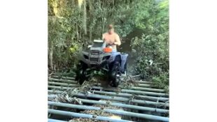 Youtube video of funny ATV fail on pipe bridge