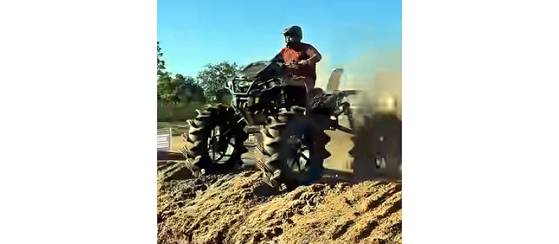 Youtube Shorts video of ATV rider crashing over the bars and into the mud