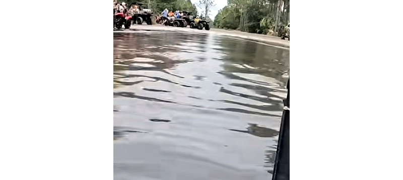 Youtube video of a snorkeled ATV owning a very deep mud hole