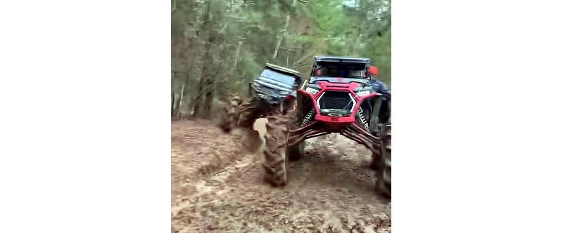 Youtube video of two side-by-sides mudding